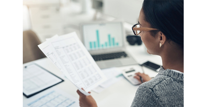 woman reading expense report 